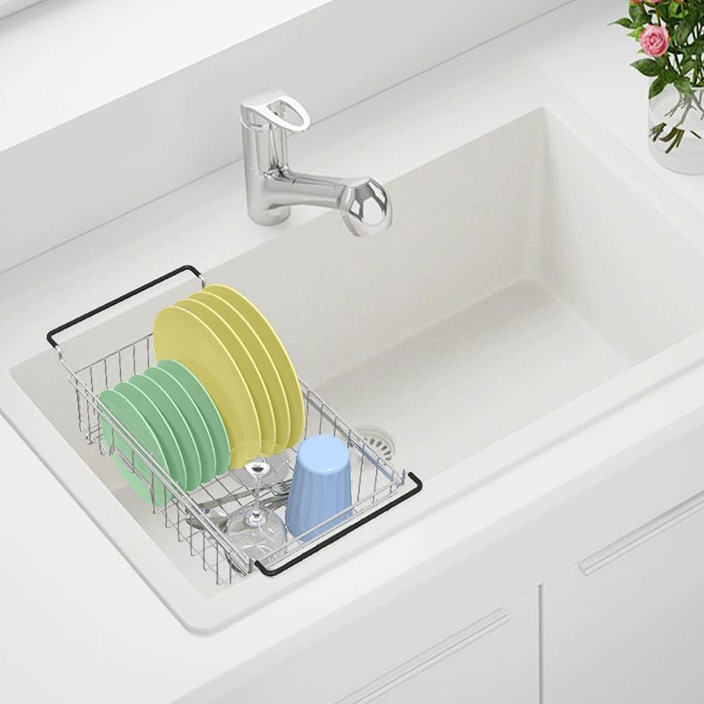 Adjustable stainless steel over-the-sink dish drying rack with dishes inside, depicting the rack's capacity and design.